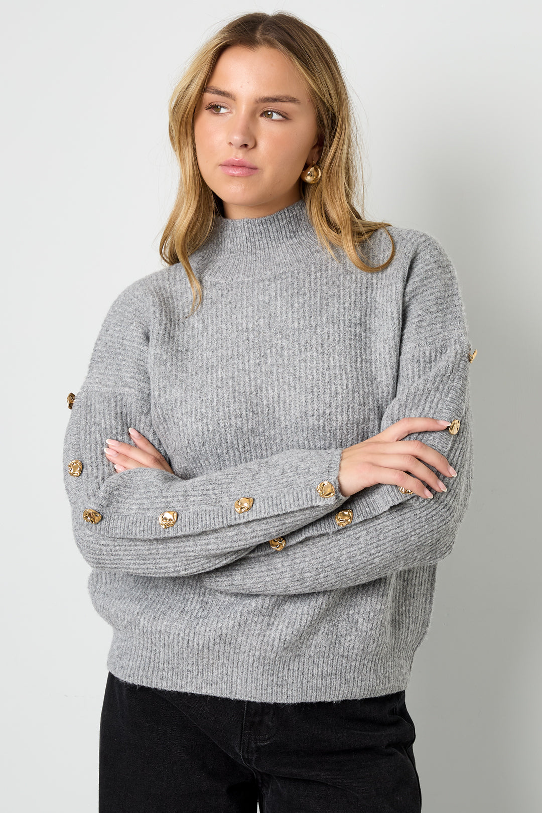 Sweater with buttons on the sleeves