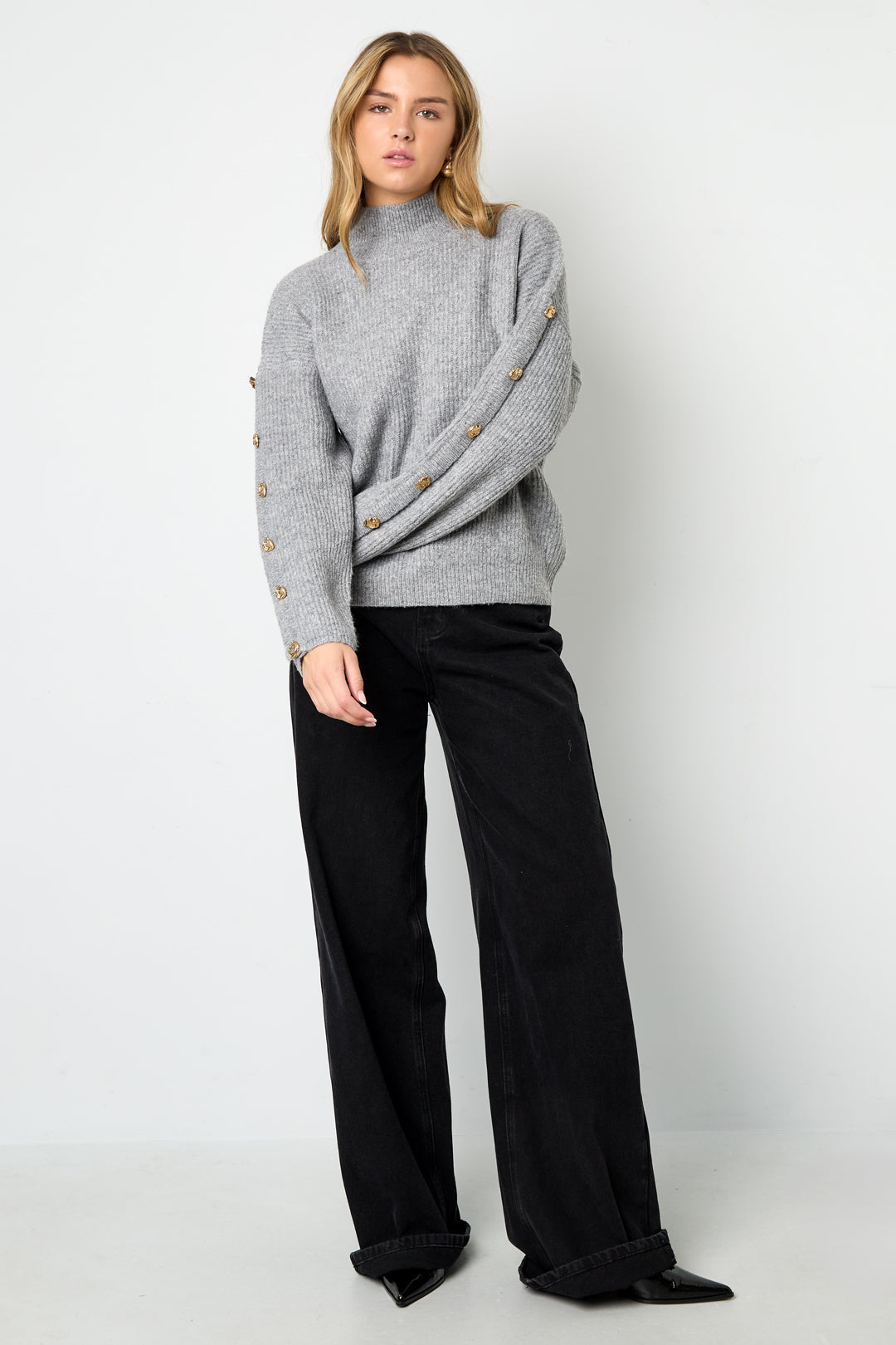 Sweater with buttons on the sleeves